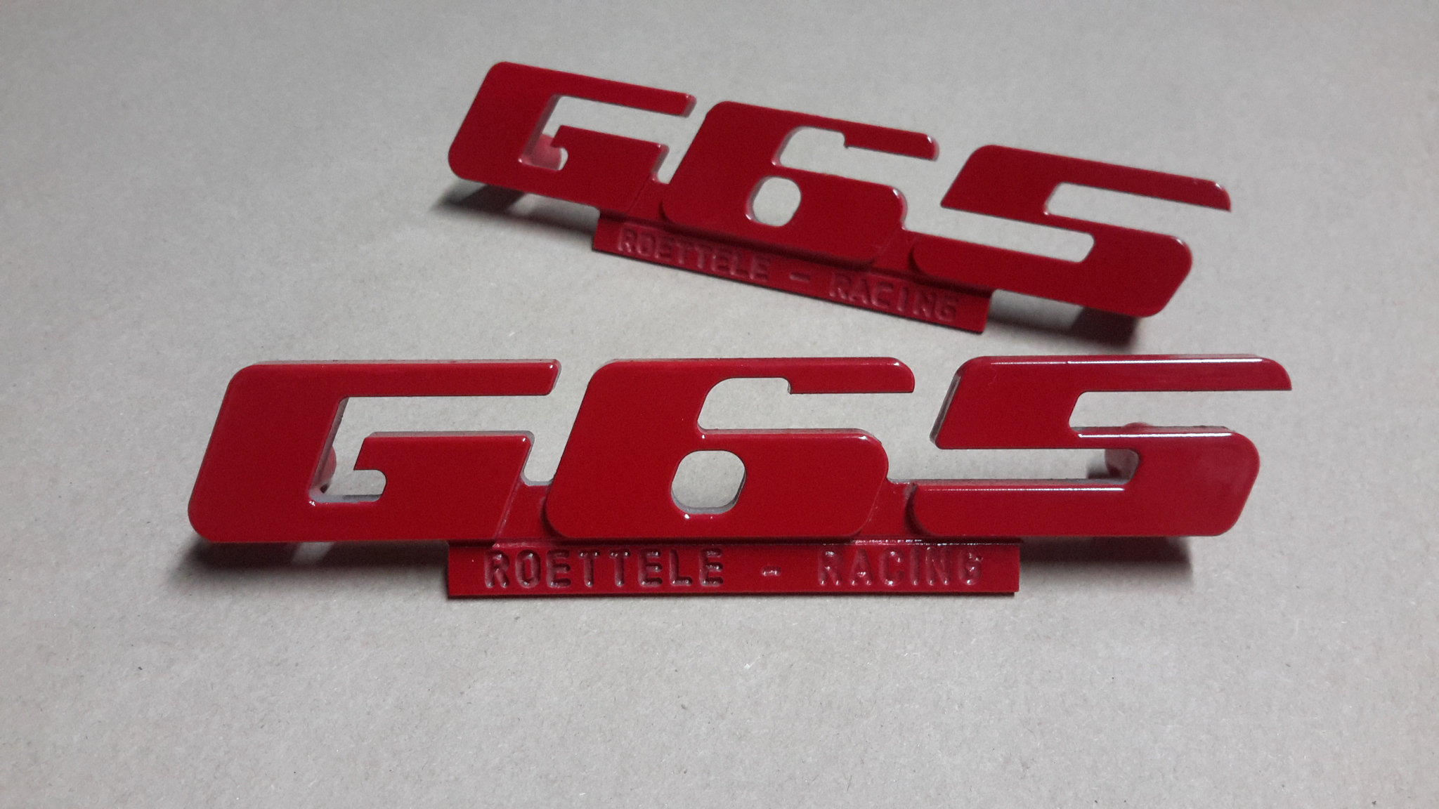 Emblem für den G65 Kühlergrill aus Aluminium mit Werbung