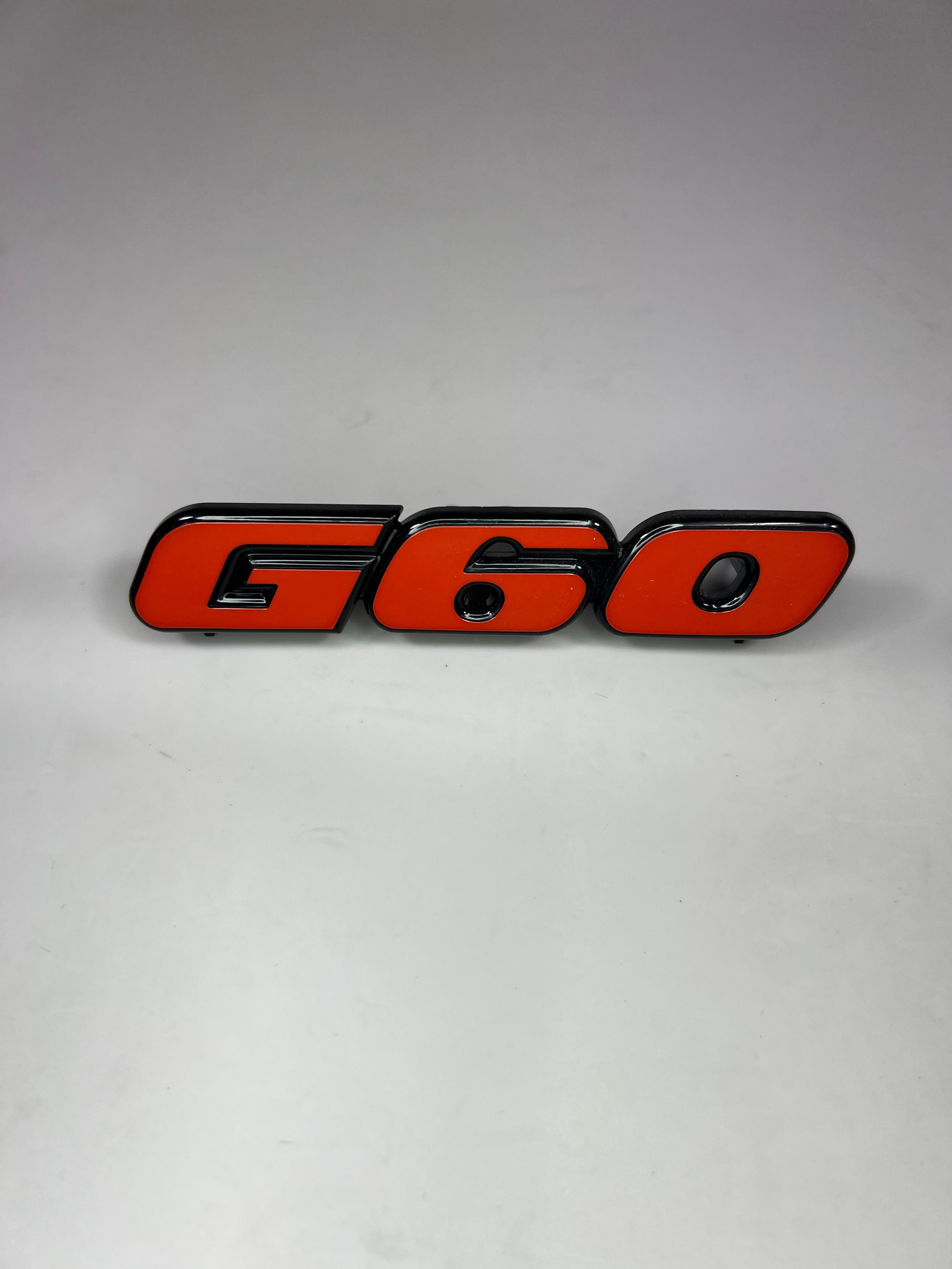 Emblem für den G60 Kühlergrill aus Kunststoff für Passat 35i Corrado Golf II 19E in der Farbe  rot