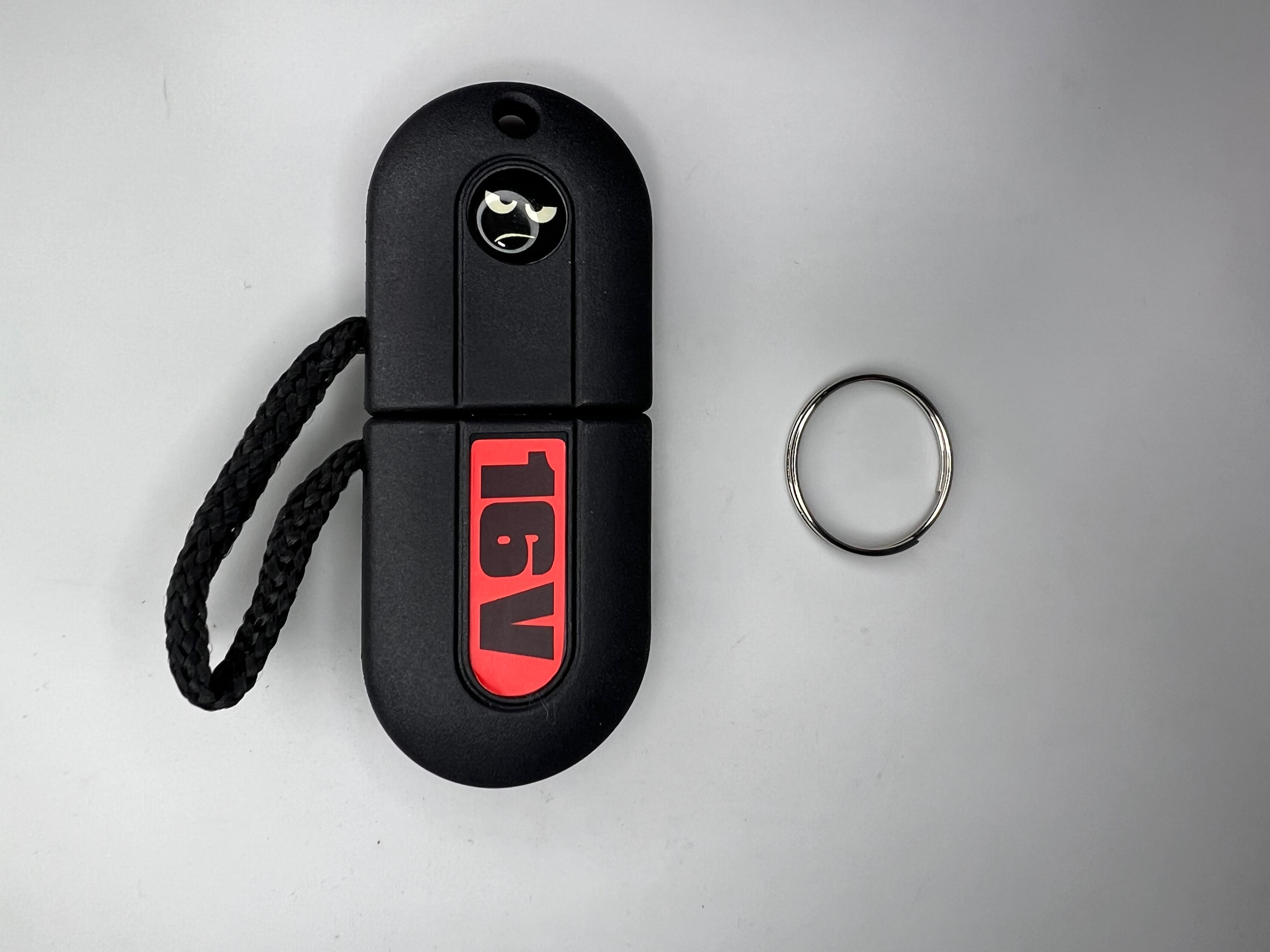 Schlüssel roher Hauptschlüssel für Zündschloss in Kunstoffmantel mit 16V Schriftzug und Logo