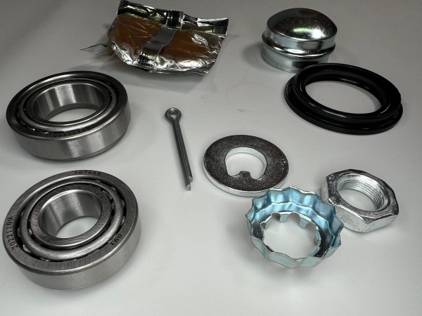 Radlager Satz für die Trommelbremse Polo G40 hinten mit Kronenmutter Einstellplatte Mutter Druckplatte Splint und Fettkappe Dichtring original Teilenummer : 191 598 625 